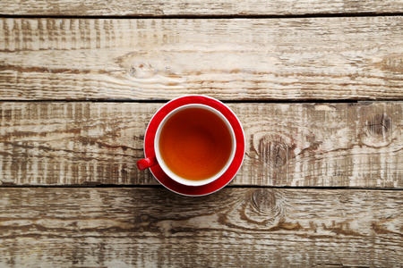 Cup of tea on a grey wooden tableの写真素材