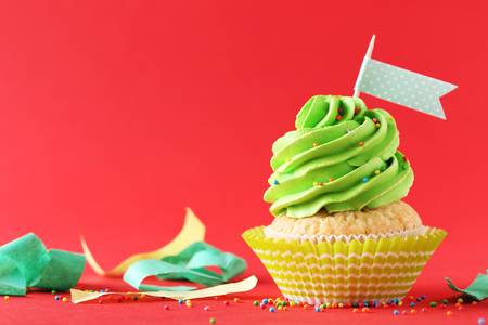 Tasty cupcake on a red backgroundの写真素材