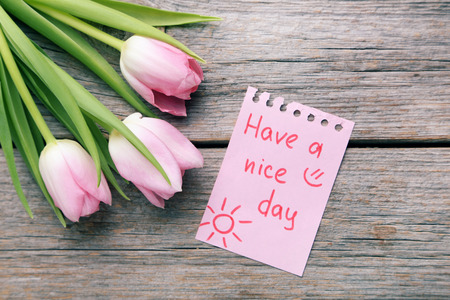 Bouquet of tulips on grey wooden tableの写真素材