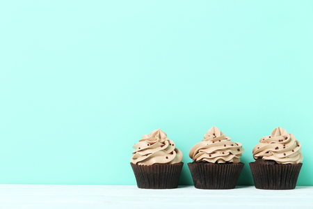 Tasty cupcakes on a green backgroundの写真素材