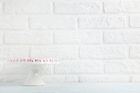Cake stand on a brick wall backgroundの写真素材