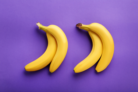 Sweet bananas on the purple backgroundの写真素材