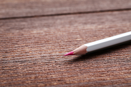 Drawing colourful pencil on brown wooden tableの写真素材