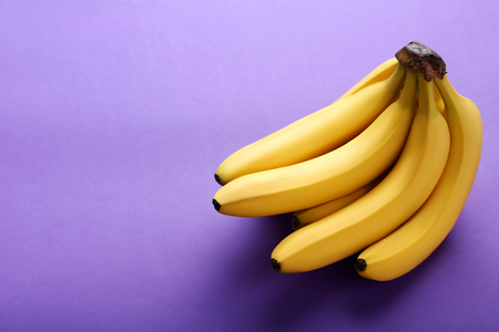 Sweet bananas on the purple backgroundの写真素材