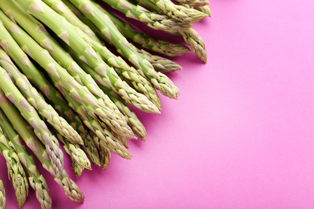 Green asparagus on the pink backgroundの写真素材
