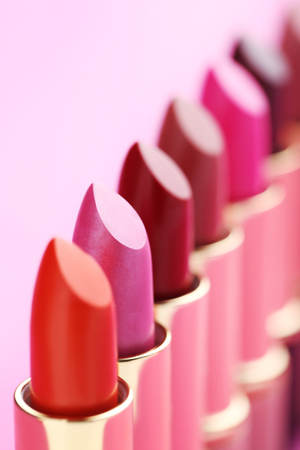 Colorful lipsticks on a pink backgroundの写真素材