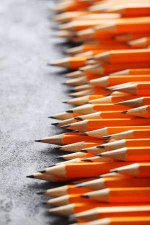 Yellow pencils on grey wooden tableの写真素材