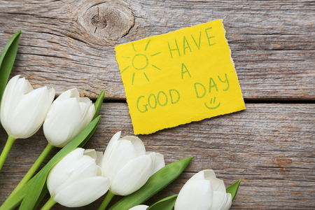 Bouquet of tulips on grey wooden tableの写真素材