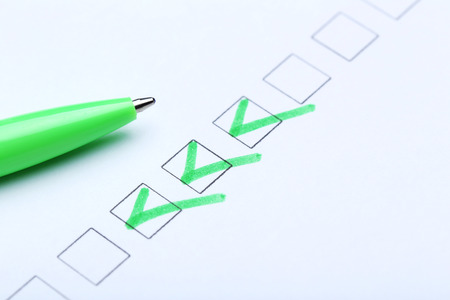 Check boxes on white paper