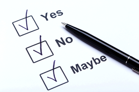 Check boxes yes, no and maybe on white paperの写真素材