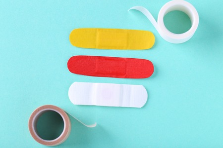 Medical plasters on mint backgroundの写真素材