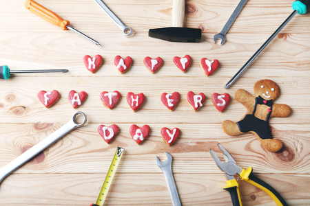 Different tools with cookies for fathers day on wooden tableの写真素材