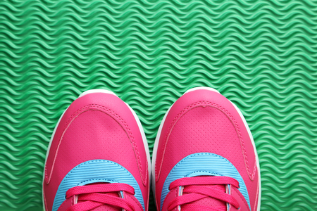 Sport shoes on green backgroundの写真素材