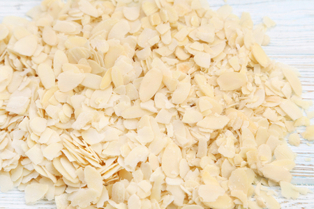 Almonds flakes on wooden tableの写真素材