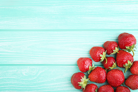 Fresh strawberries on mint wooden tableの写真素材