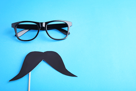 Mustache and glasses on blue backgroundの写真素材