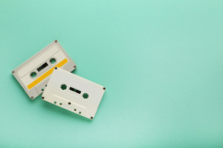 White cassette tapes on mint background