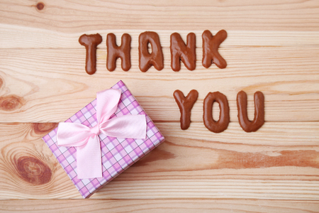 Thank You written by chocolate cookies alphabet with gift boxの写真素材