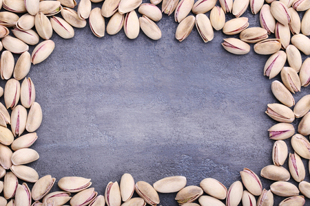 Pistachios on grey wooden tableの写真素材
