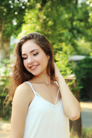 Portrait of beautiful young woman in parkの写真素材