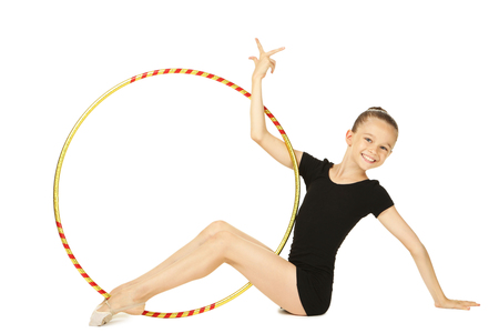 Young girl gymnast with hoop on white backgroundの写真素材
