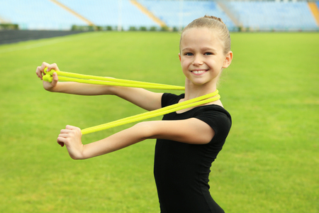Young girl gymnast with ropeの写真素材