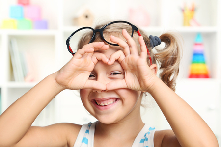 Portrait of little girl with glassesの写真素材
