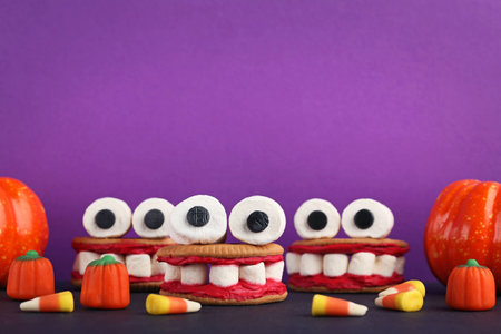 Halloween cookies jaws with marshmallows on purple backgroundの写真素材