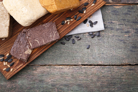 Tasty pieces of halva on brown cutting boardの写真素材