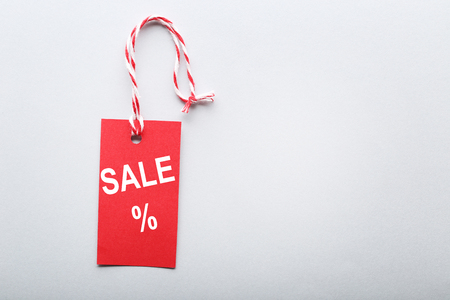 Red sale tag on grey backgroundの写真素材