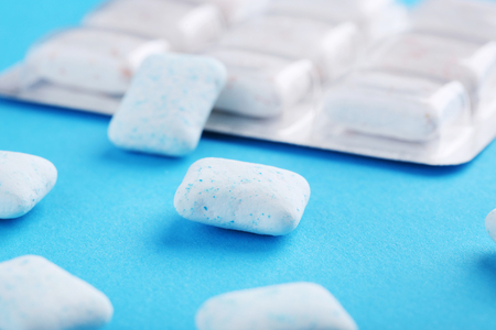 Chewing gums on blue backgroundの写真素材