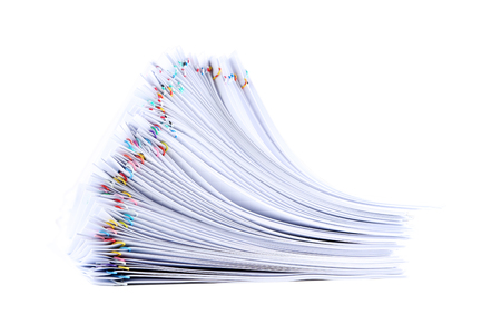 Stack of papers with paperclips on white backgroundの写真素材