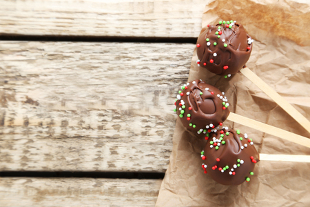Chocolate cake pops on grey wooden tableの写真素材