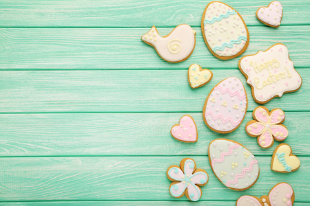 Easter cookies on mint wooden tableの写真素材