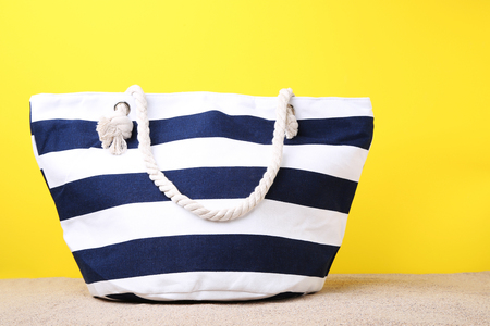 Summer bag on the beach sandの写真素材