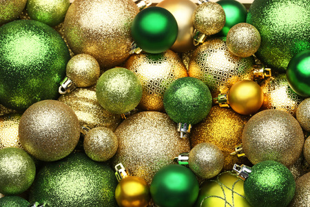 Golden and green christmas baubles backgroundの写真素材