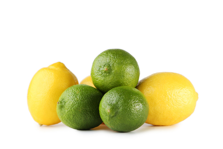 Ripe limes and lemons isolated on whiteの写真素材