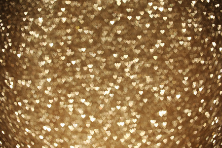 Beautiful golden heart bokeh background