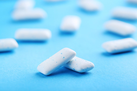 Chewing gums on blue background