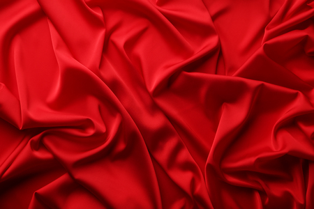 Background of red satin fabricの写真素材