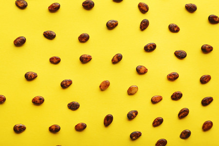 Watermelon seeds on yellow backgroundの写真素材