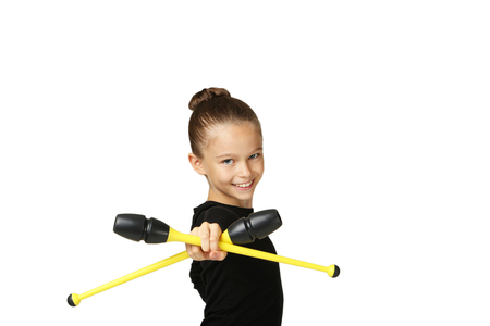 Young girl gymnast with mace isolated on whiteの写真素材