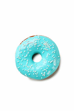 Tasty donut with sprinkles isolated on a whiteの写真素材