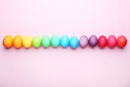 Colorful easter eggs on pink backgroundの写真素材