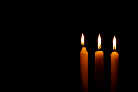 Burning candles on black backgroundの写真素材