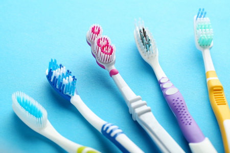 Toothbrushes on blue backgroundの写真素材