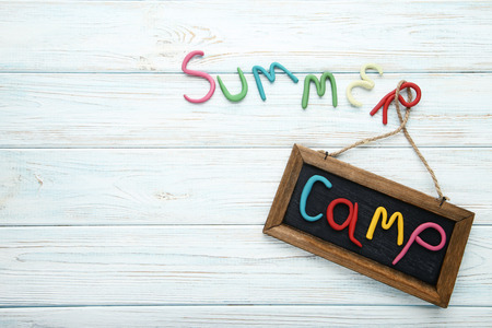 Inscription Summer Camp with frame on white wooden tableの写真素材