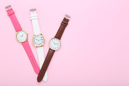 Wrist watches on pink backgroundの写真素材