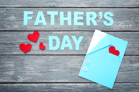Inscription Fathers Day on grey wooden tableの写真素材