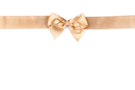 Golden bow with ribbon isolated on white backgroundの写真素材